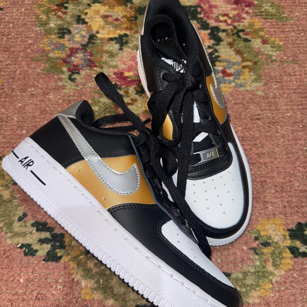 Nike Kids Black, Gold, and Silver Sneakers